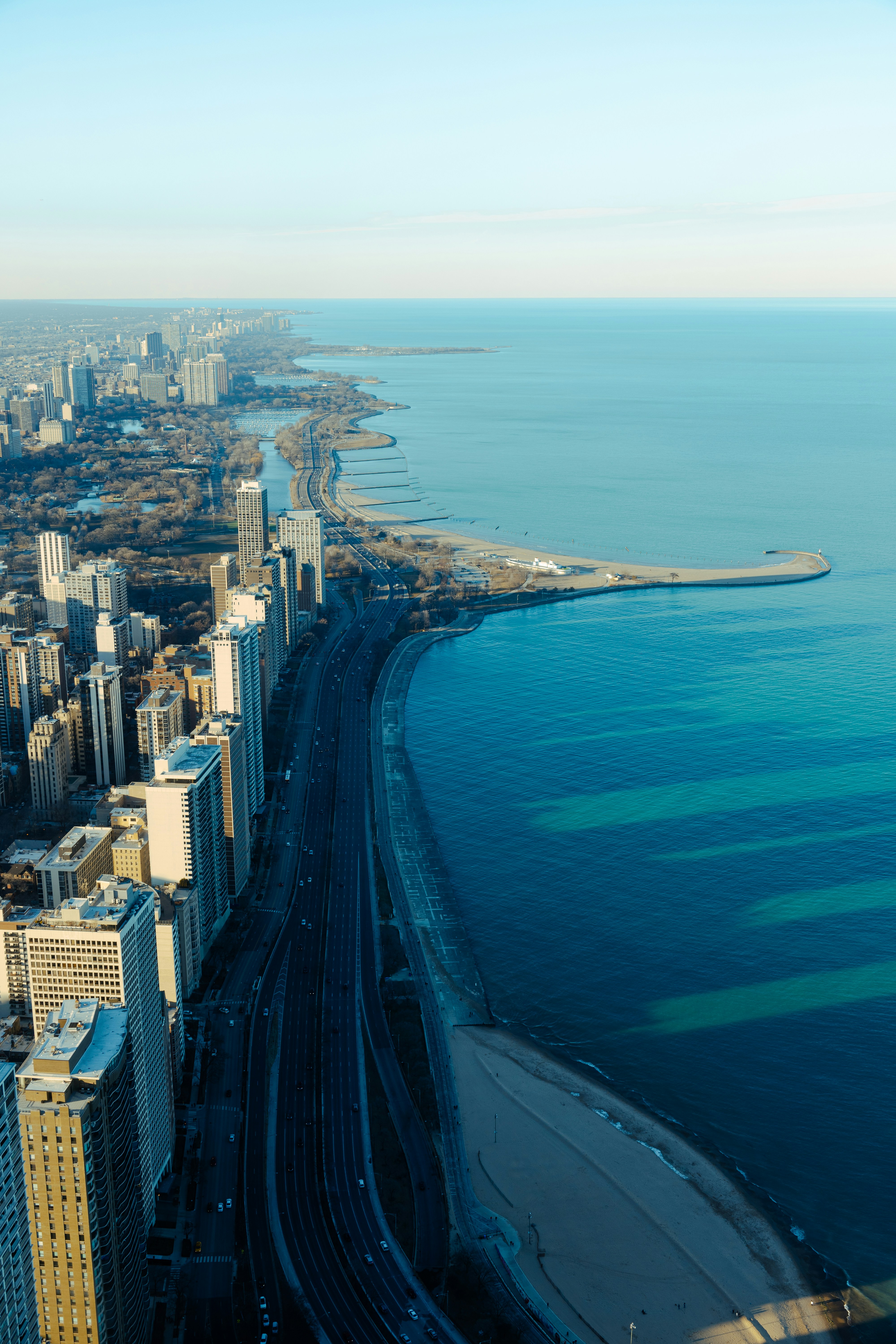 an aerial view of a city and the ocean