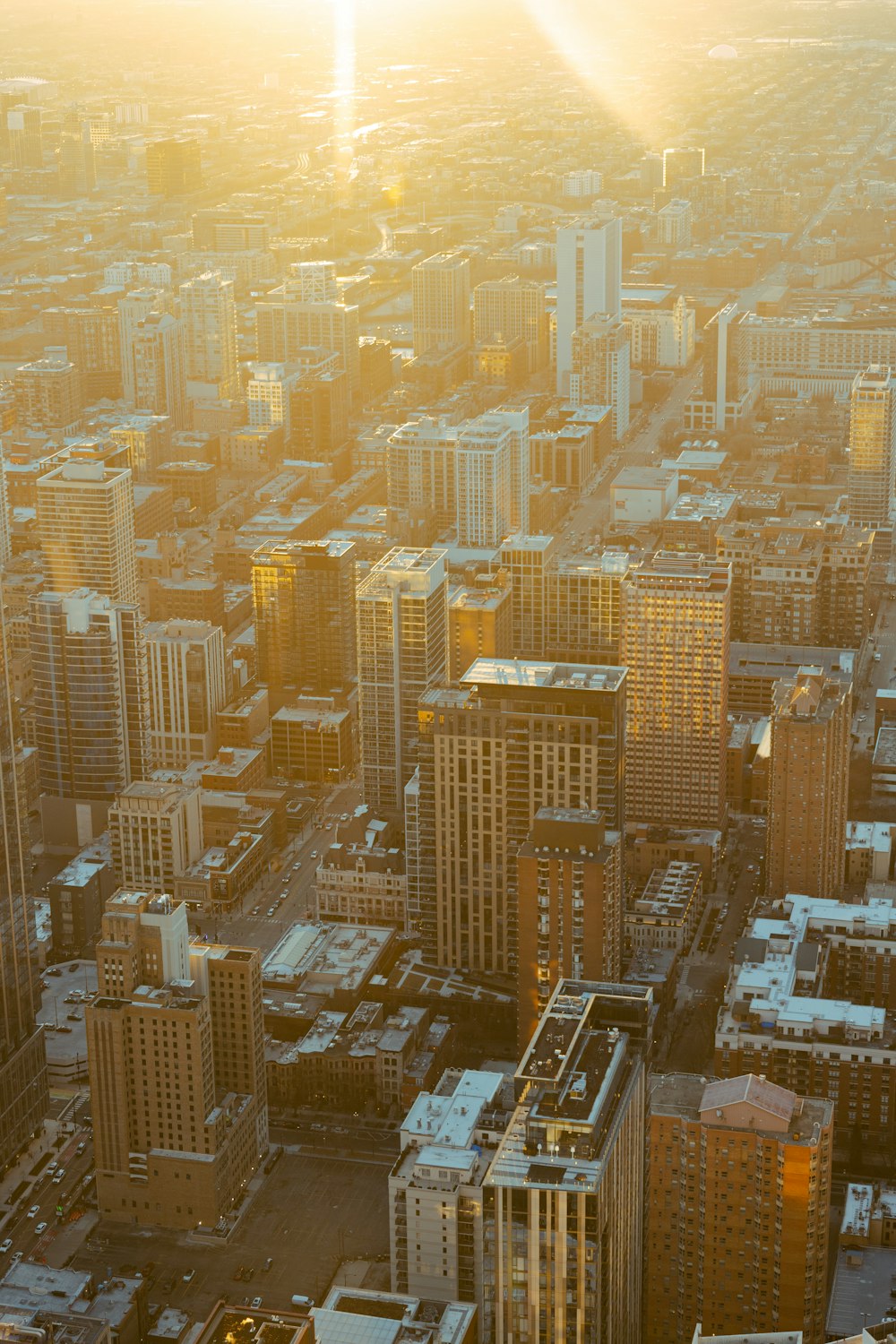 an aerial view of a city with tall buildings