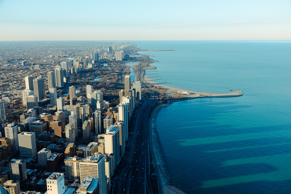 an aerial view of a city and the ocean