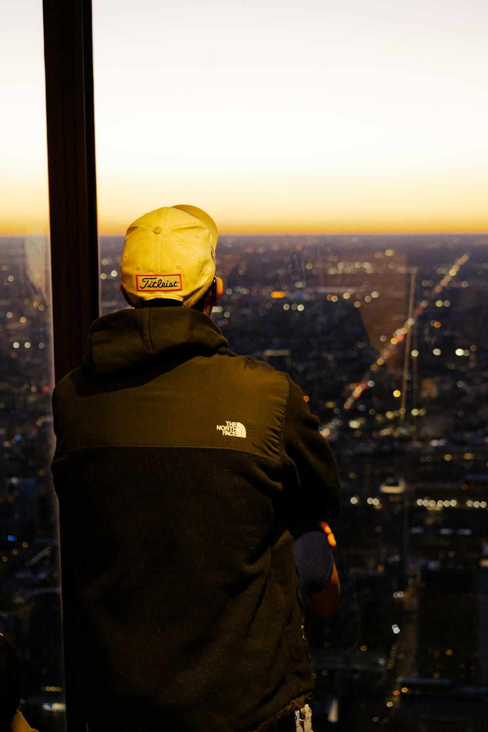 a man standing on top of a tall building