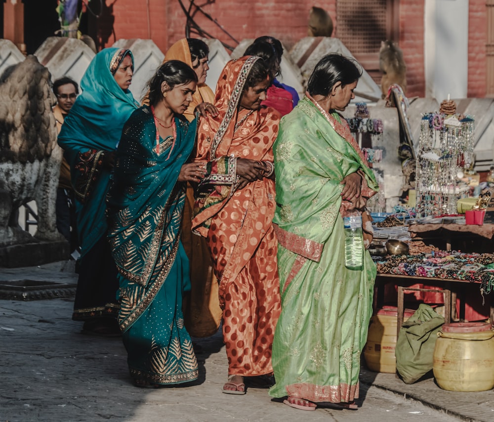 a group of women standing next to each other