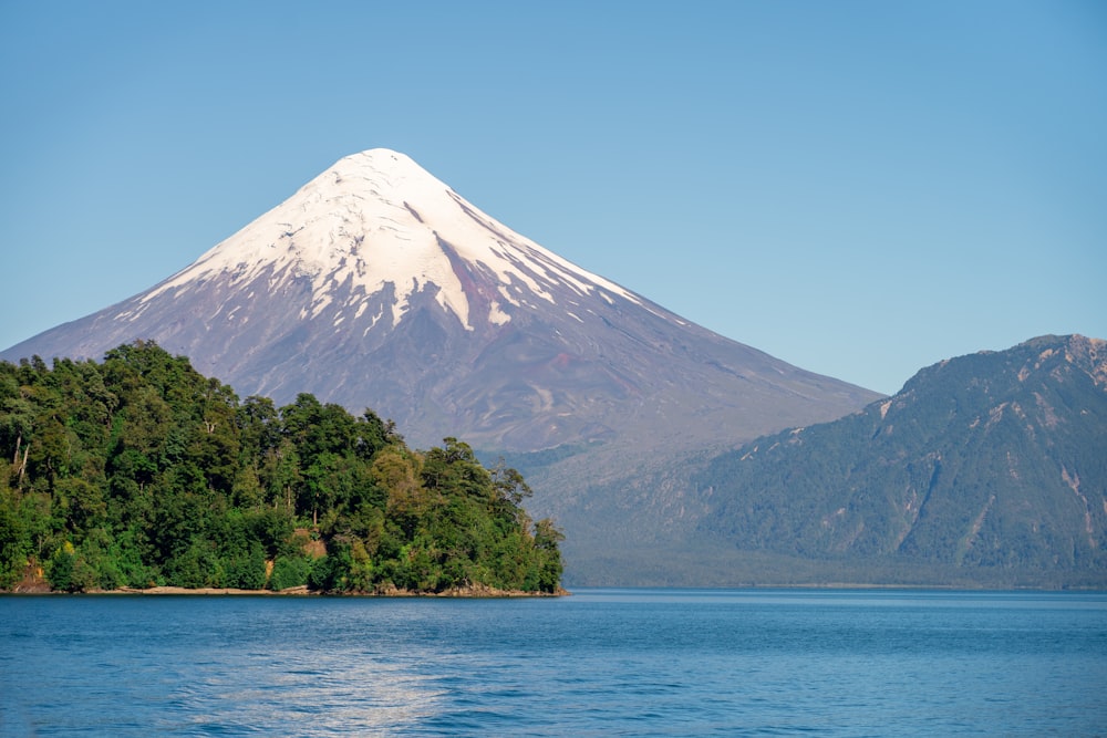 a mountain with a snow capped peak in the background