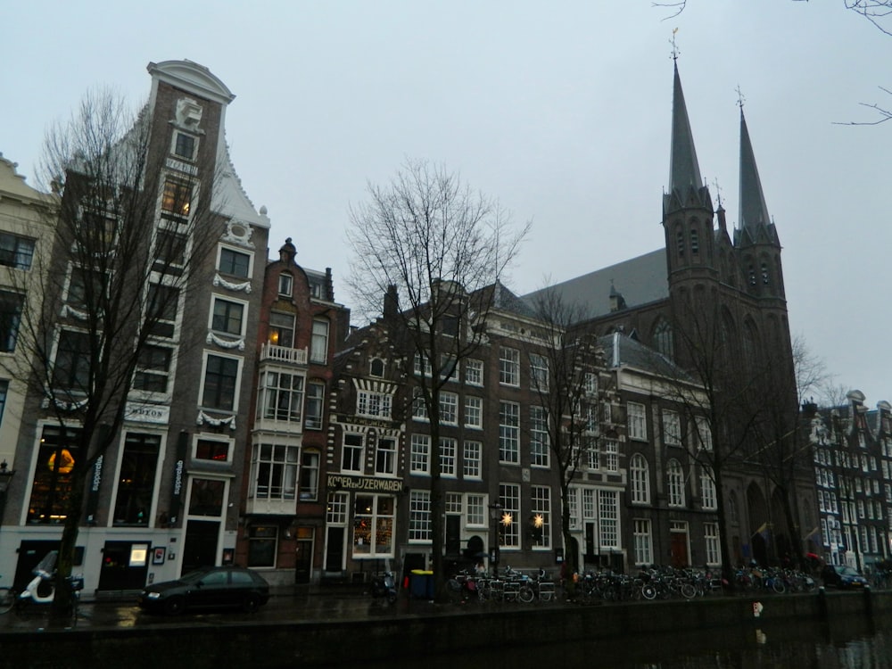 a group of buildings next to a body of water