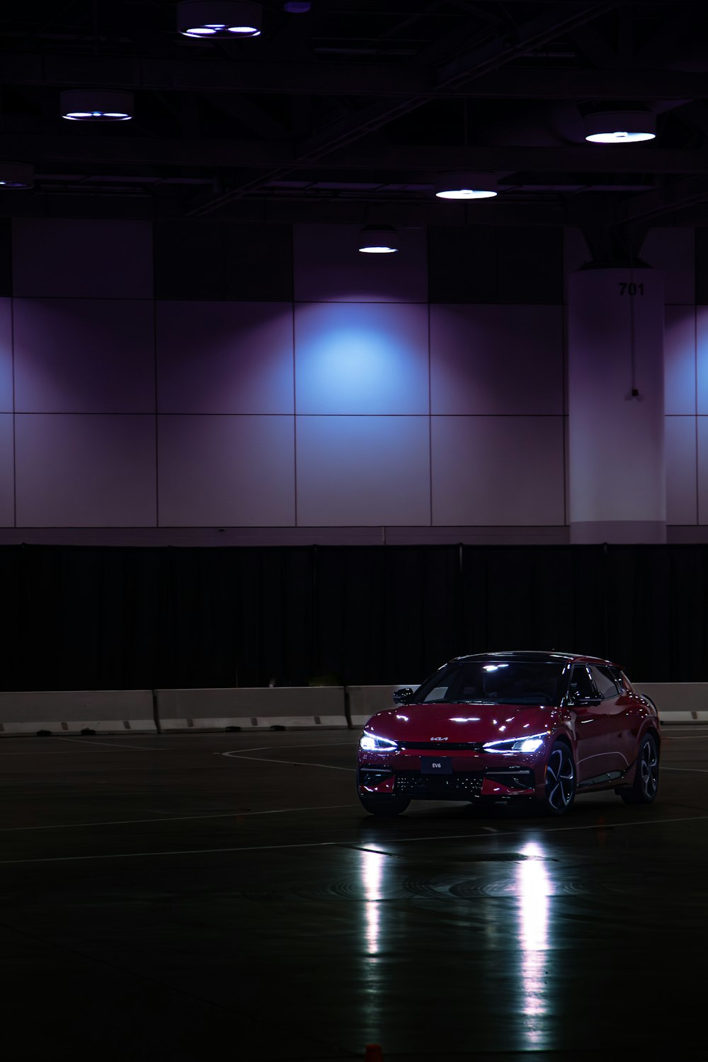 a car parked in a parking lot at night