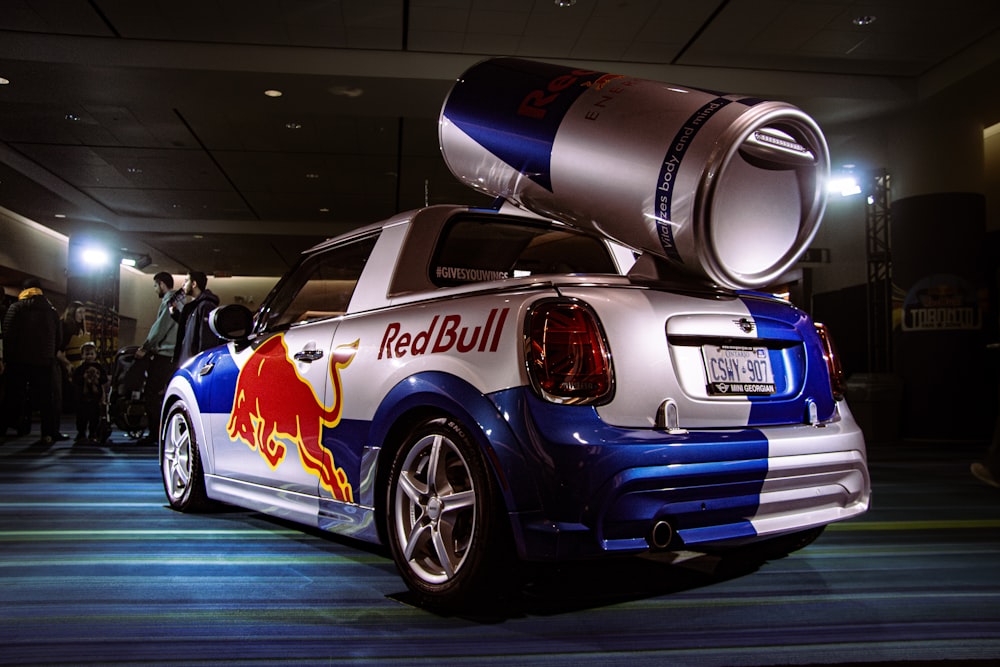 a small car with a red bull painted on it
