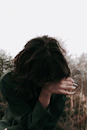 a woman with her hands on her face