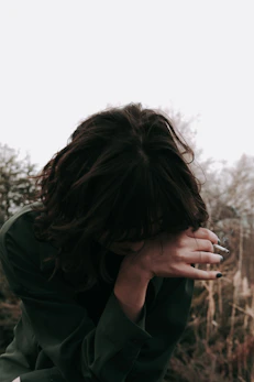 a woman with her hands on her face