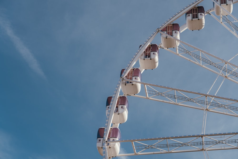 a ferris wheel is shown against a blue sky