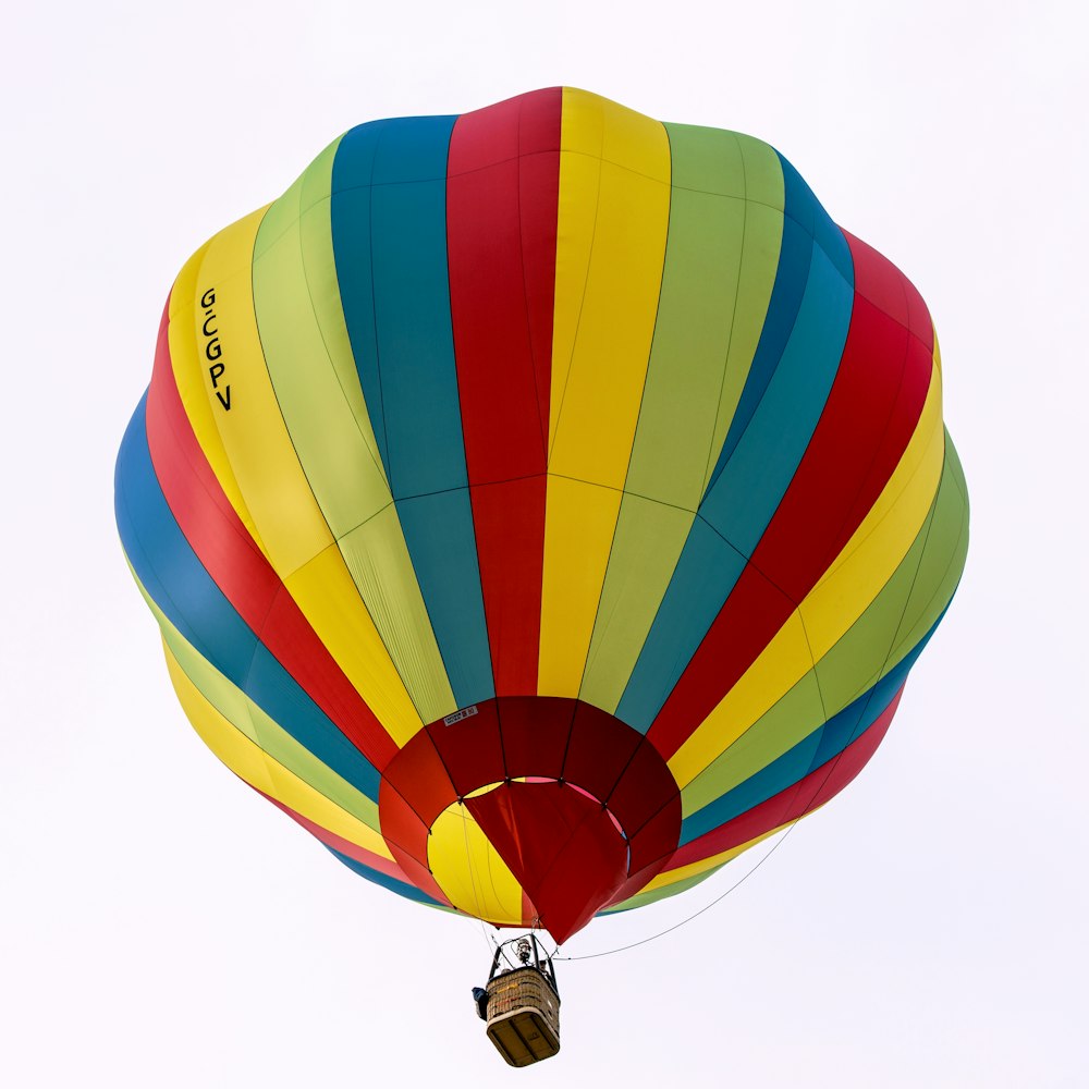 a colorful hot air balloon flying in the sky