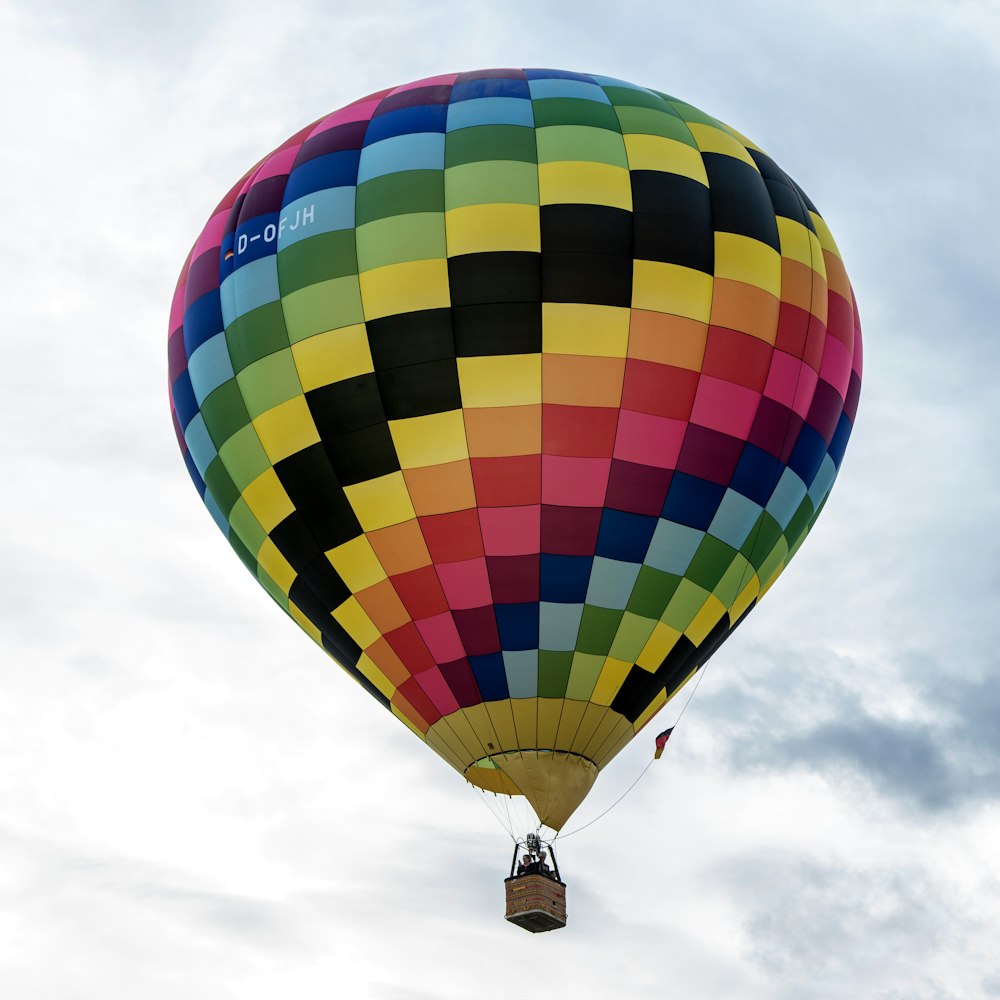 a colorful hot air balloon flying in the sky