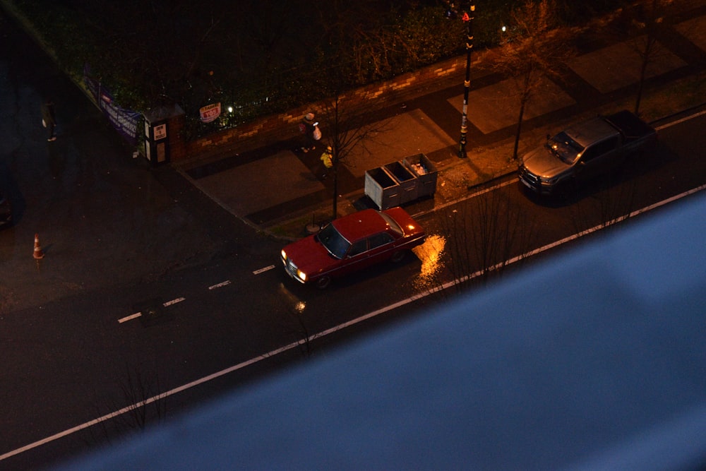 a couple of cars are parked on the side of the road