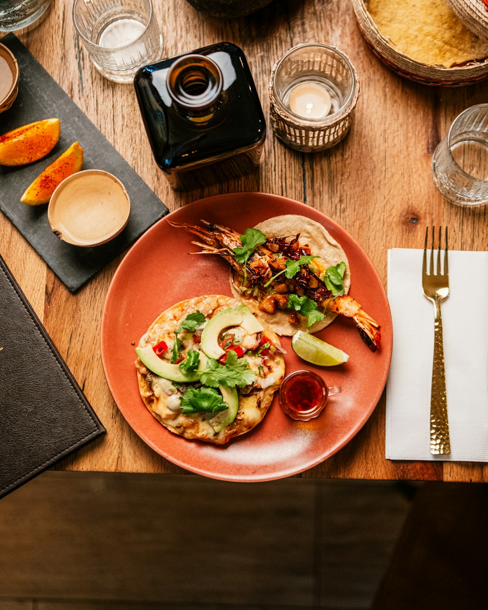 a plate of food on a wooden table