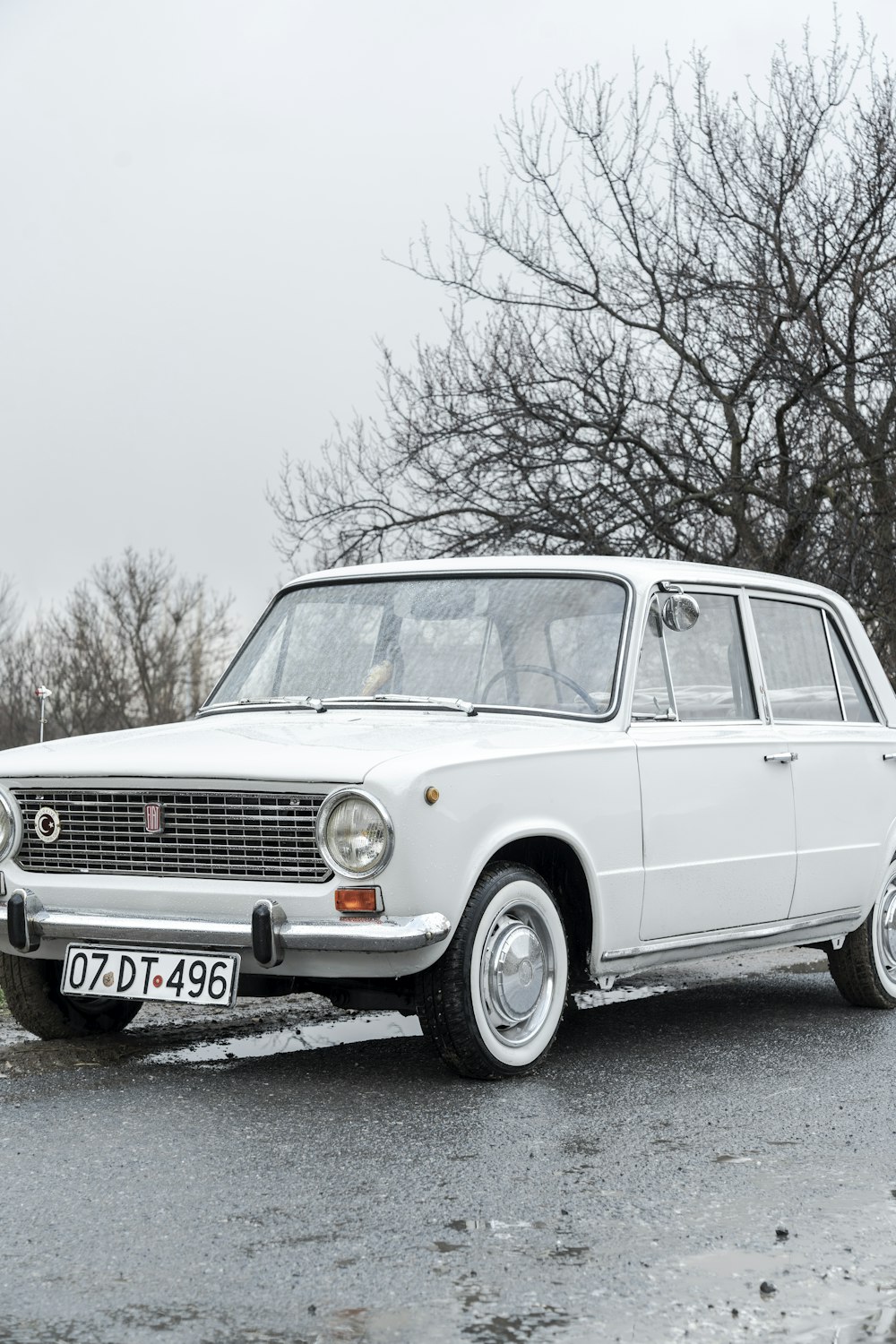 a white car parked on the side of the road