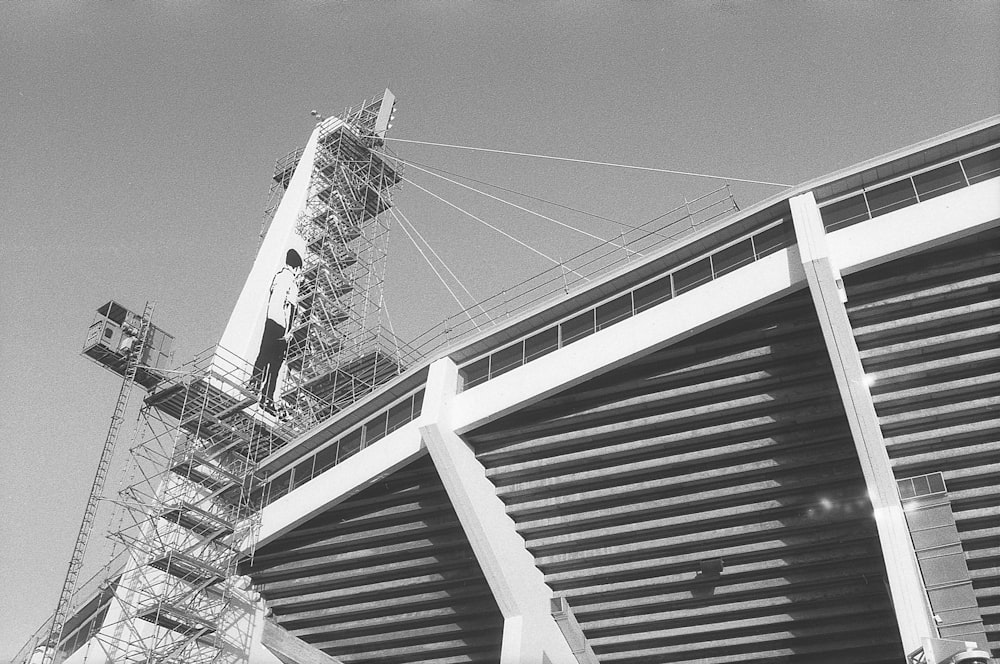 a black and white photo of a building under construction