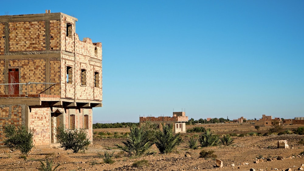 an old building in the middle of a desert