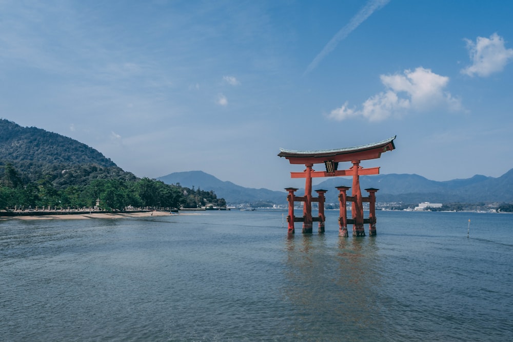 a large body of water with a small structure in the middle of it