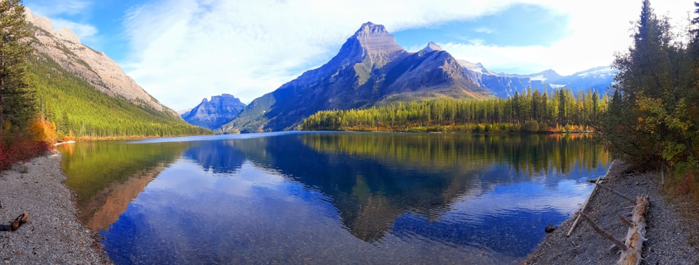 a lake surrounded by mountains and trees