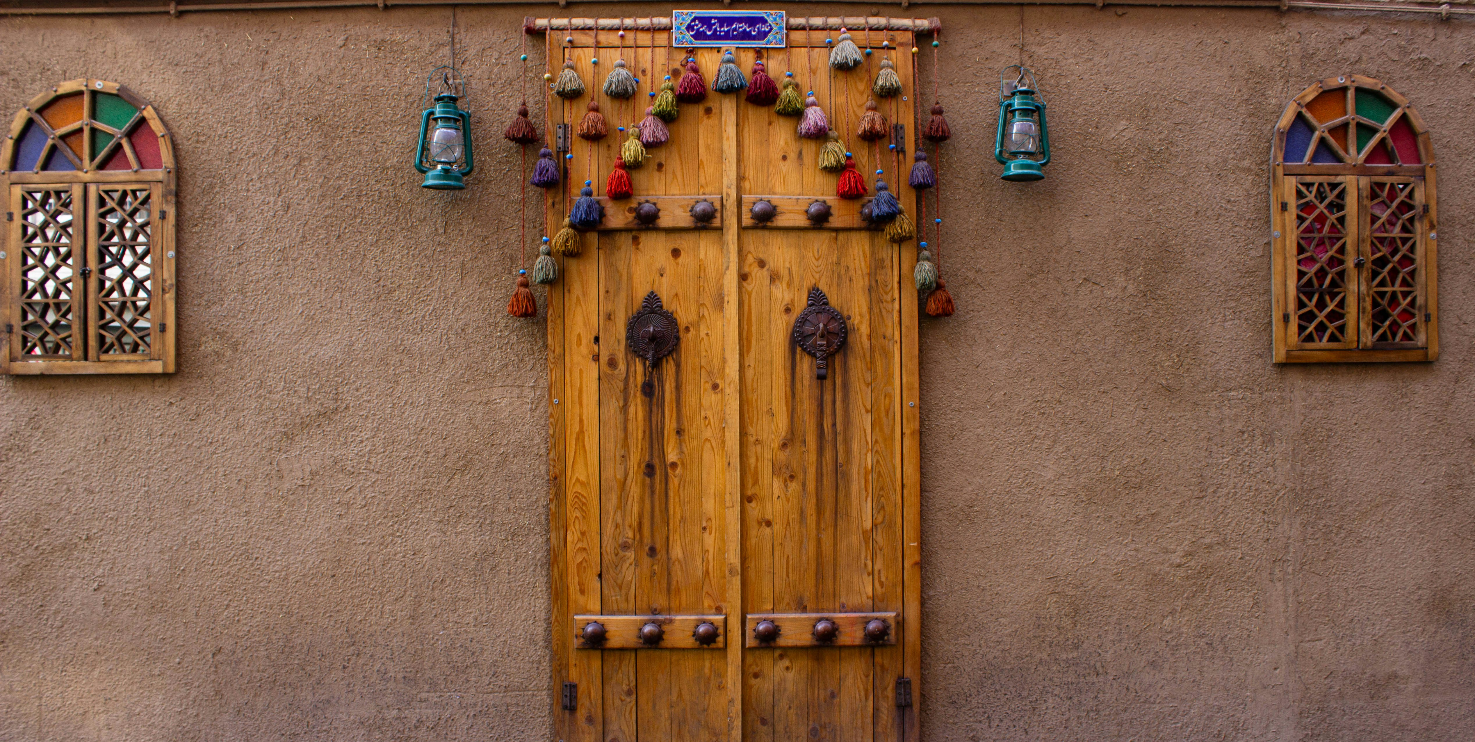 a wooden door and window on a building