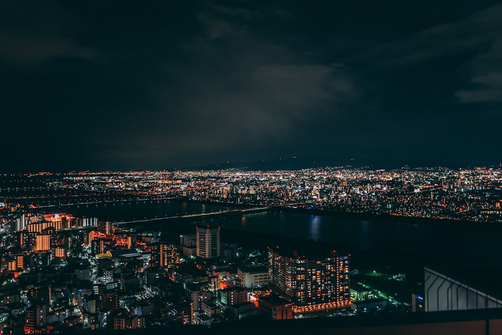 a view of a city at night from the top of a building