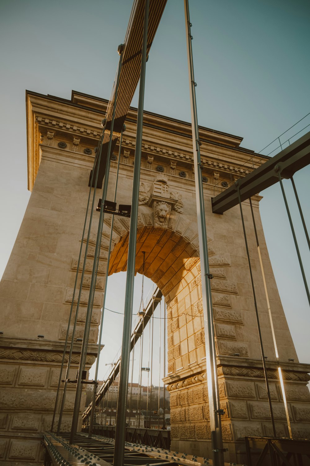 a very tall bridge with a clock on it's side