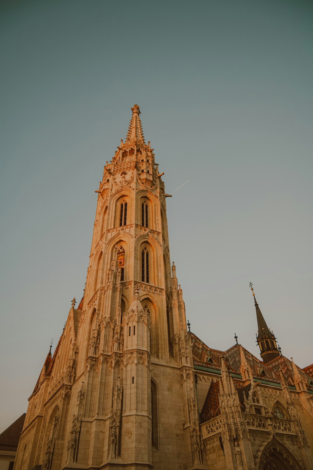 a very tall building with a clock on it's side