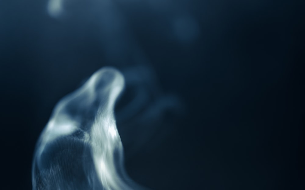 a blurry photo of smoke coming out of a pipe