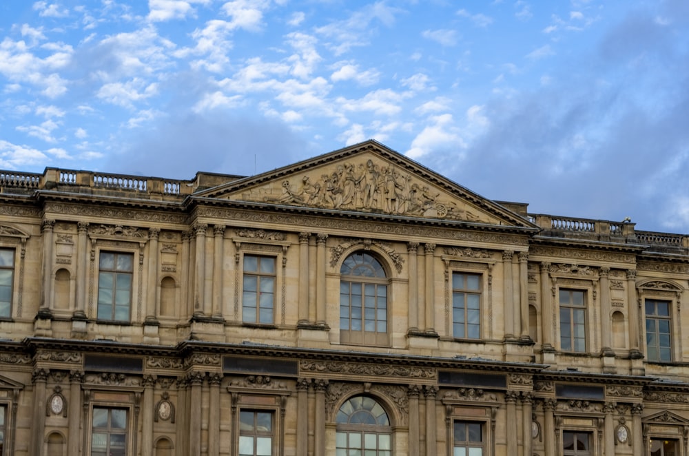 a large building with a clock on the front of it