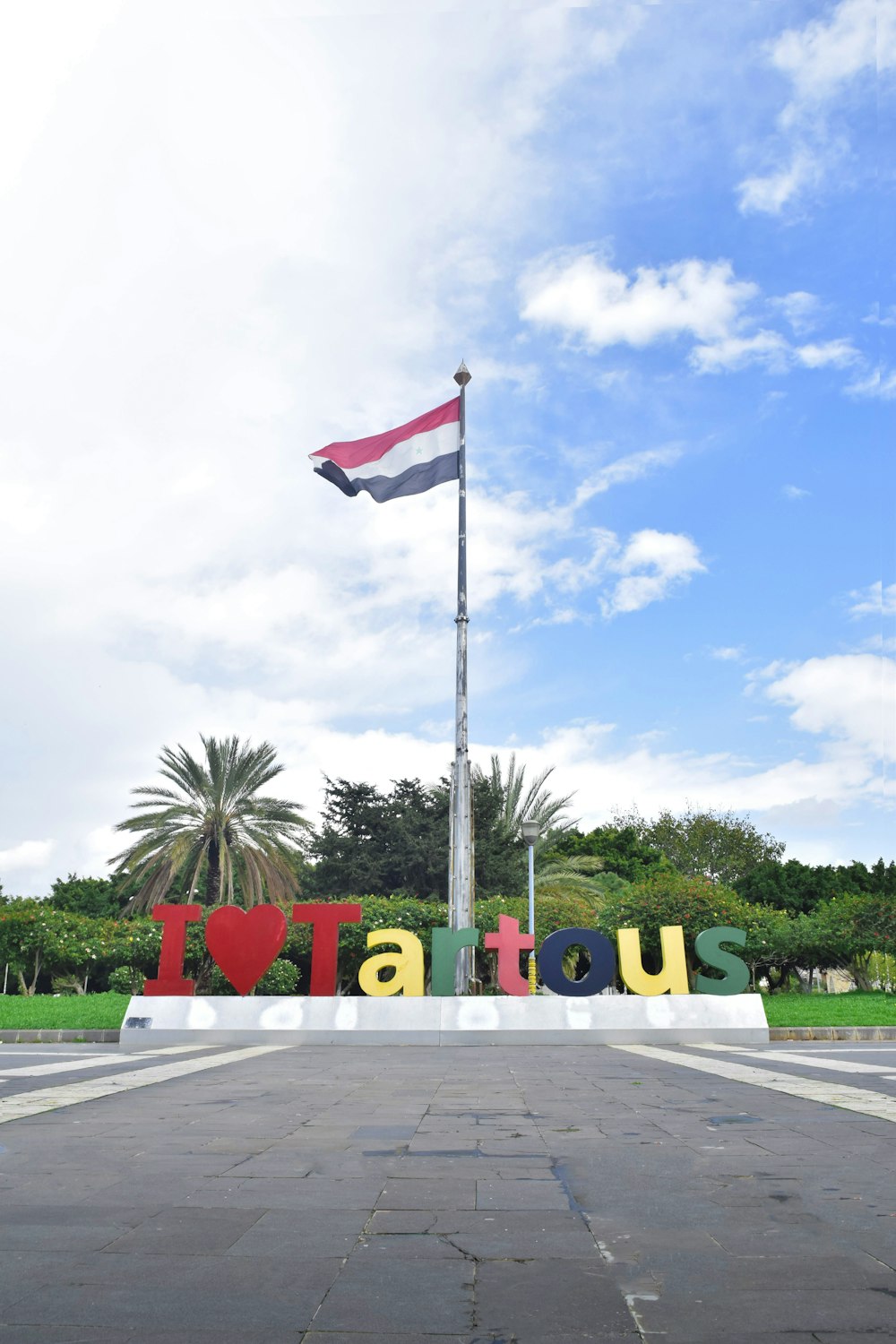 a flag flying in front of a sign that says atlanta