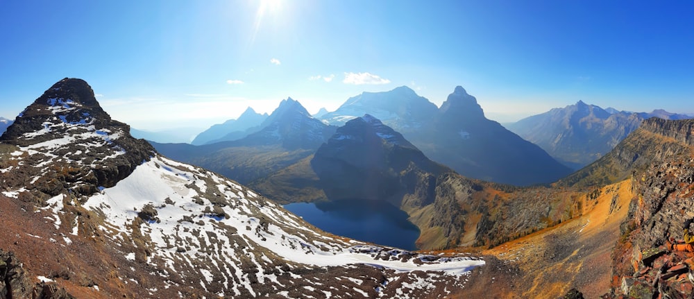 a view of a mountain range with snow on it