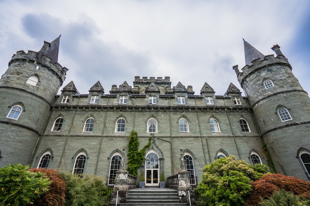 a large castle like building with a staircase leading up to it