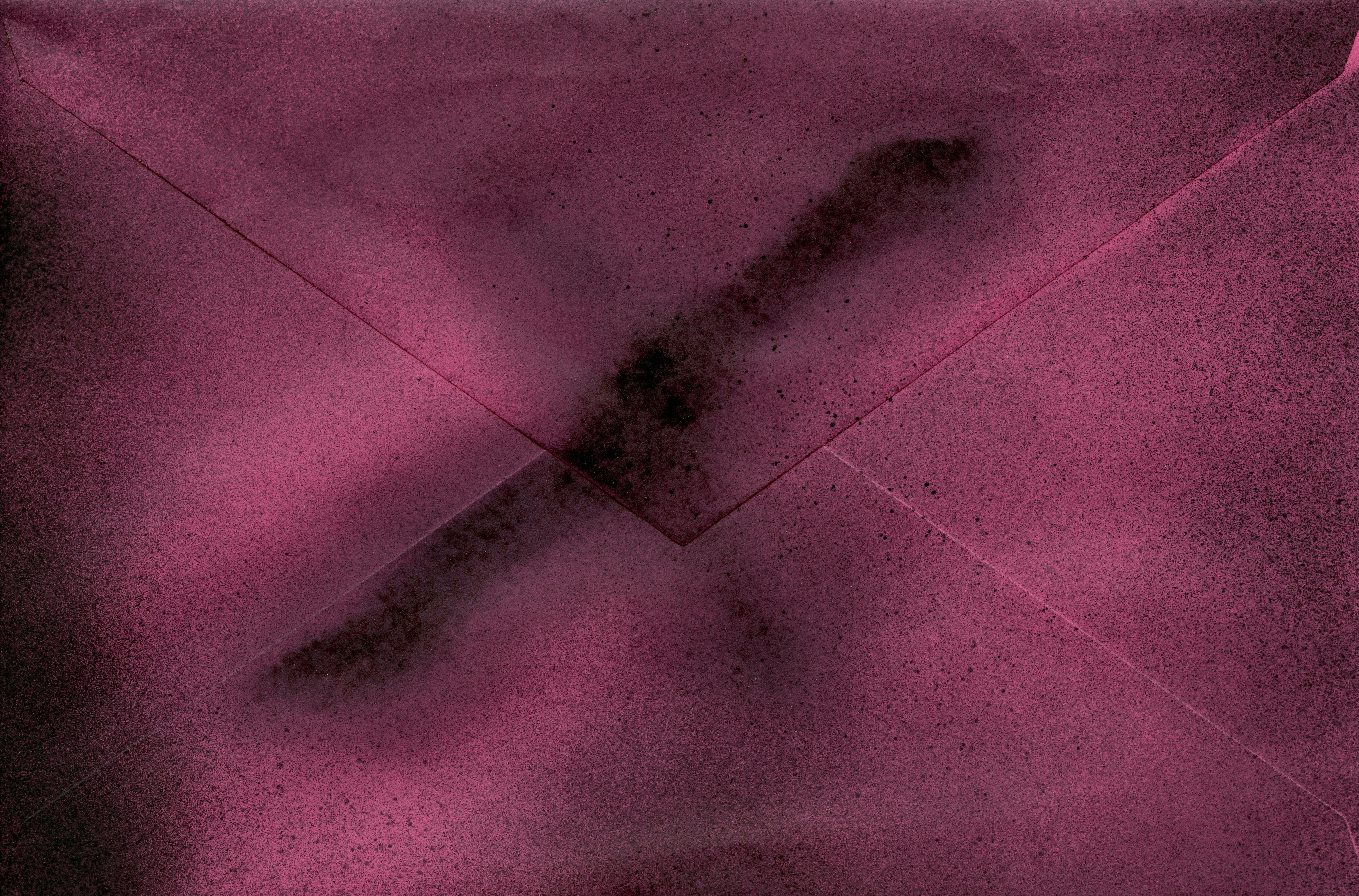a close up of an envelope with a cross on it