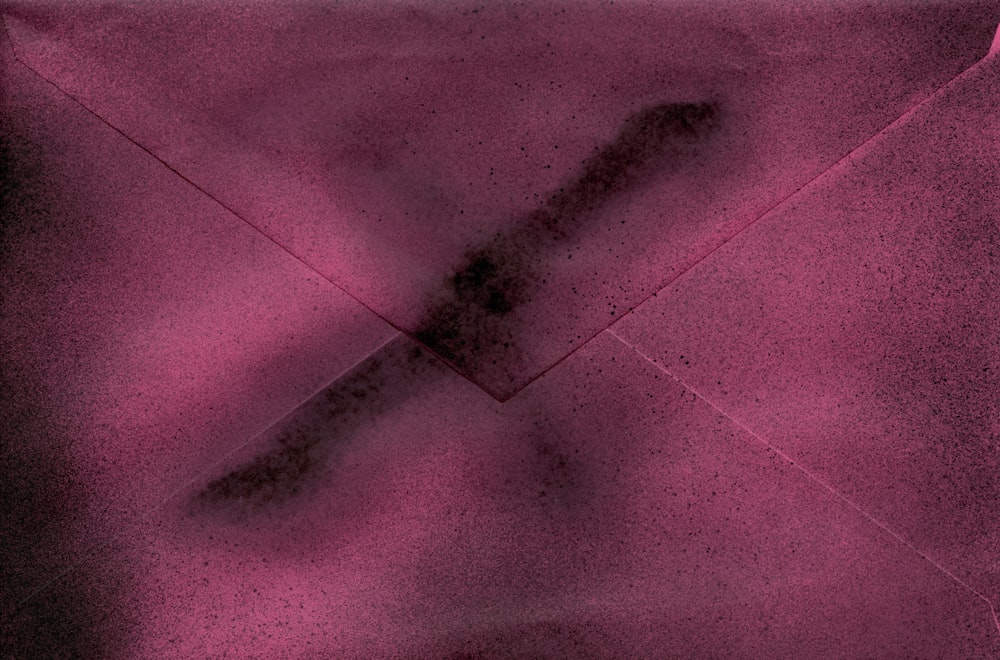 a close up of an envelope with a cross on it