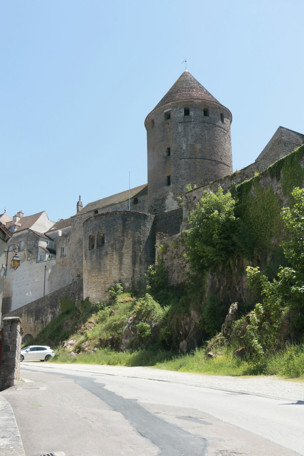 an old castle on the side of a hill