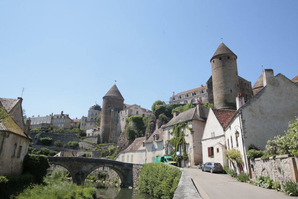 a street with a bridge and a castle in the background