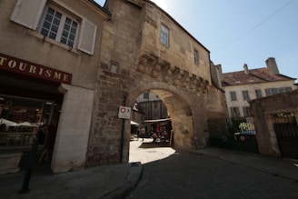 a stone building with a stone arch on the side of it