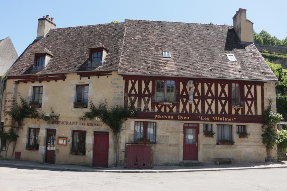 a building with a red door and windows