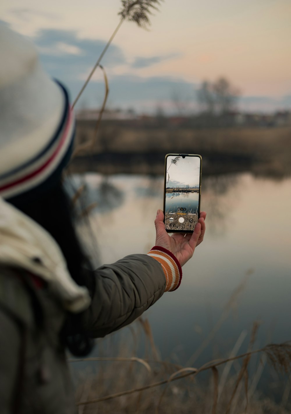 a person taking a picture with a cell phone