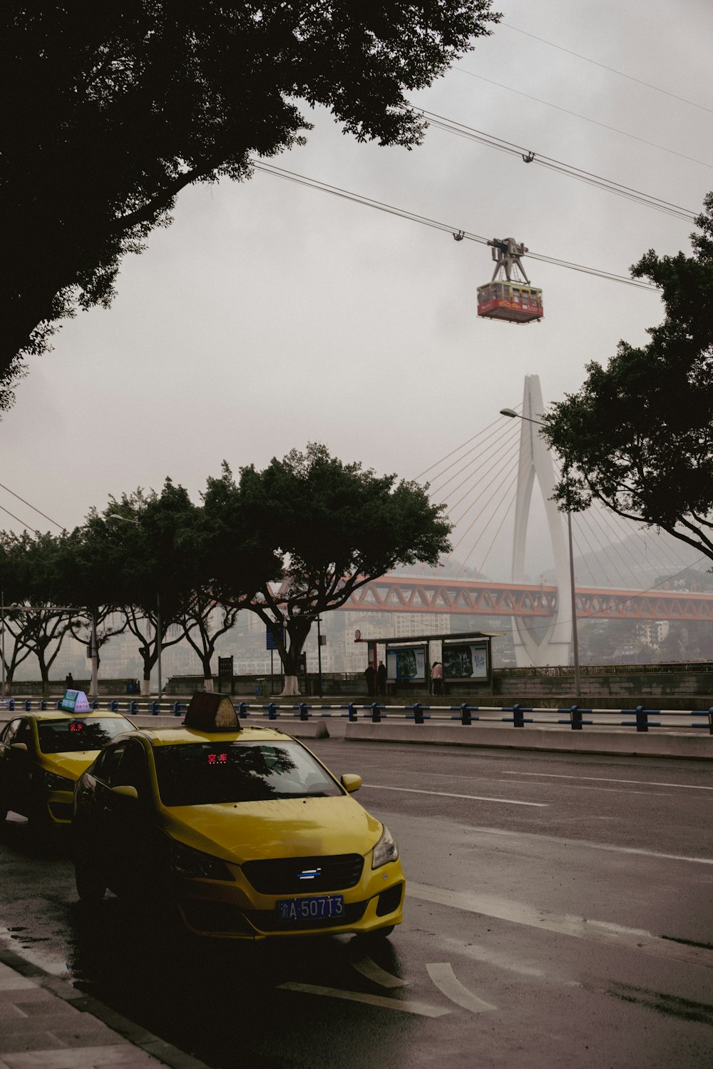 a couple of cars that are sitting in the street