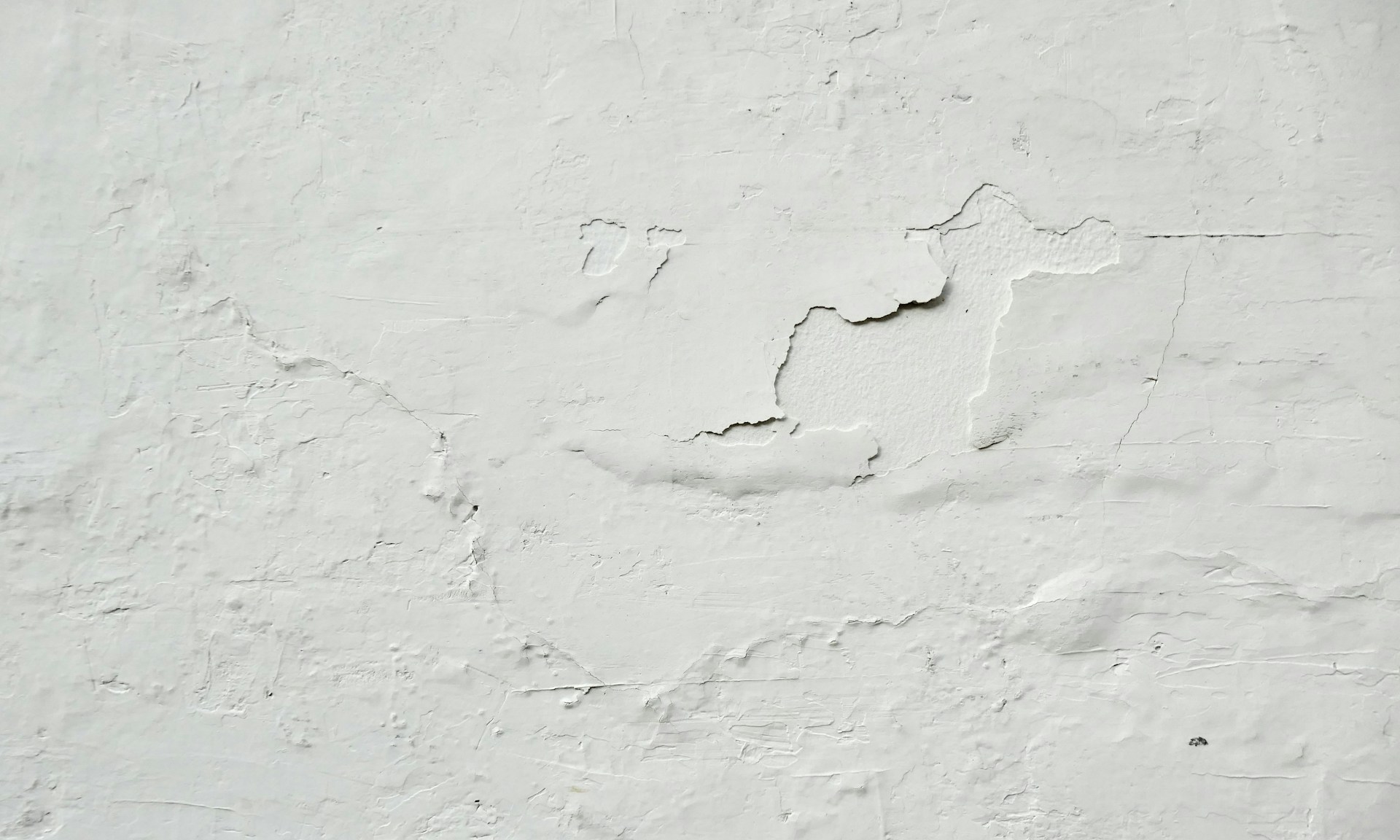 a white wall with a crack in it