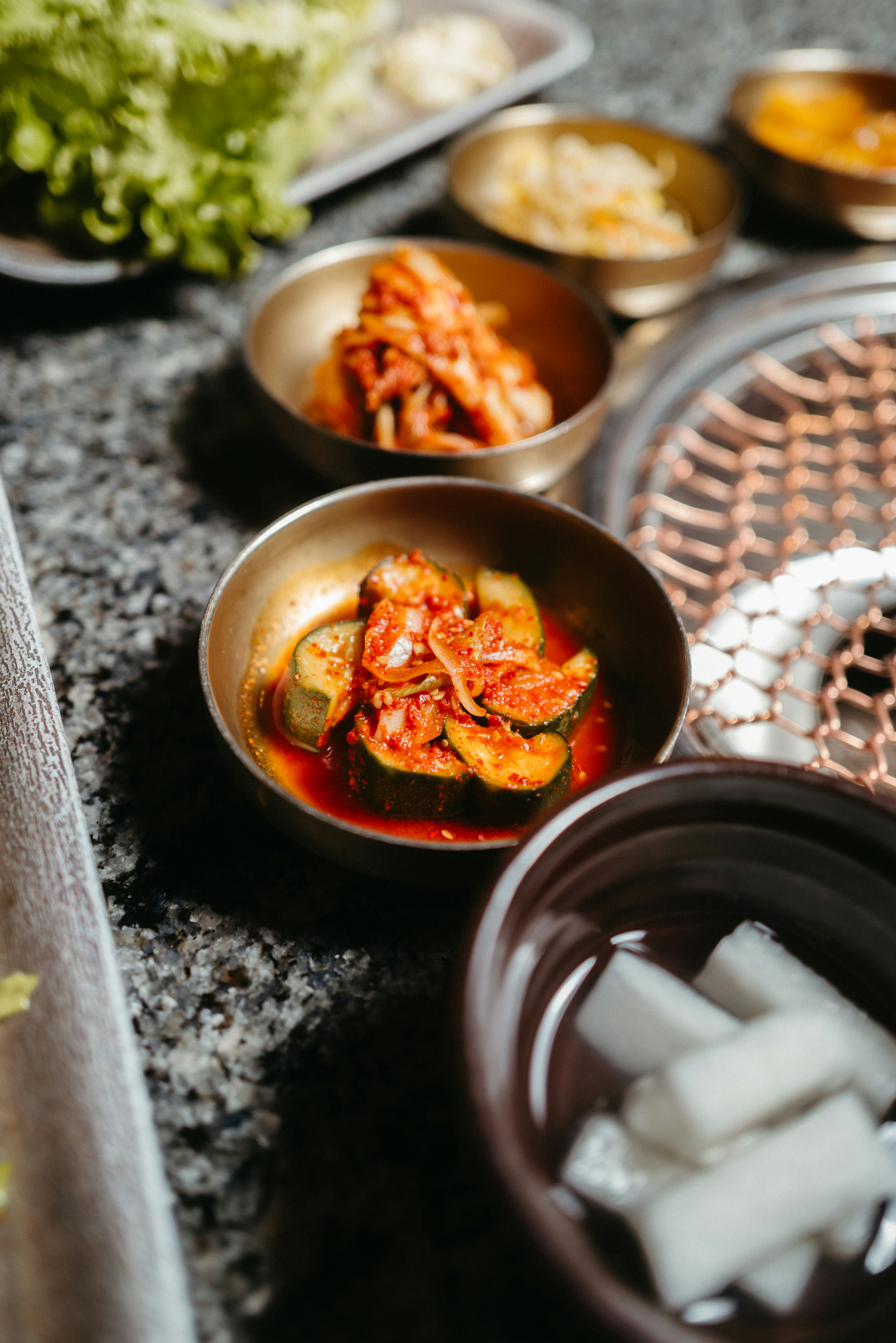 a table topped with bowls filled with food