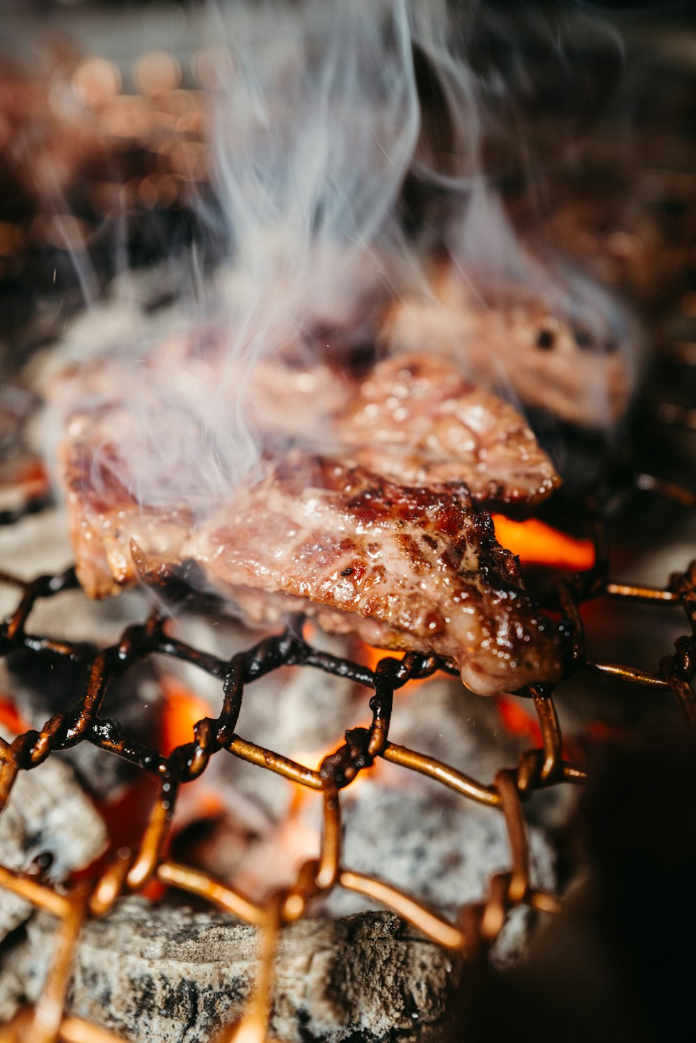 a close up of a steak on a grill