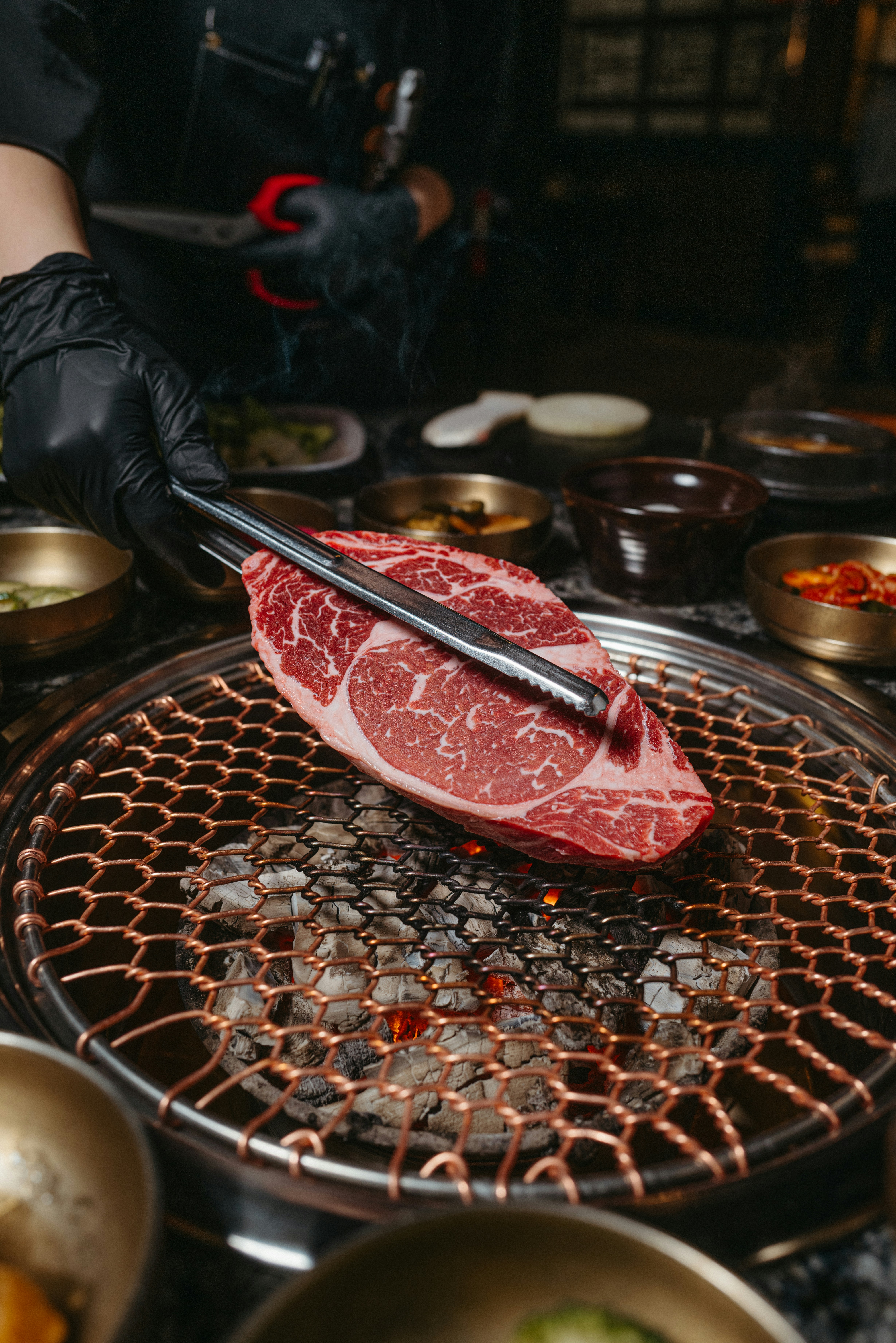 a piece of meat is being cooked on a grill