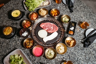 a table topped with lots of different types of food