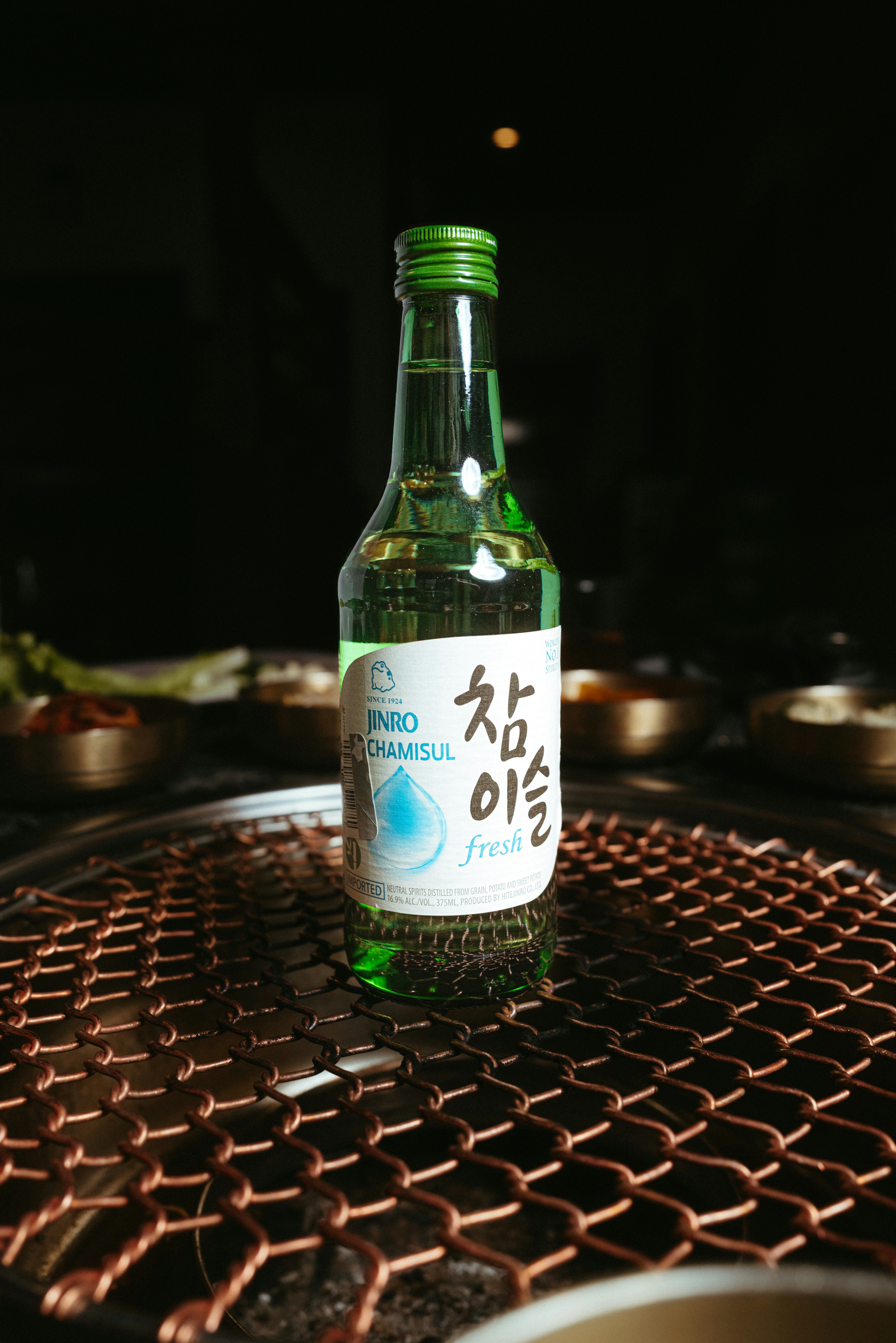 Bottles of Korean rice wine on a wooden table