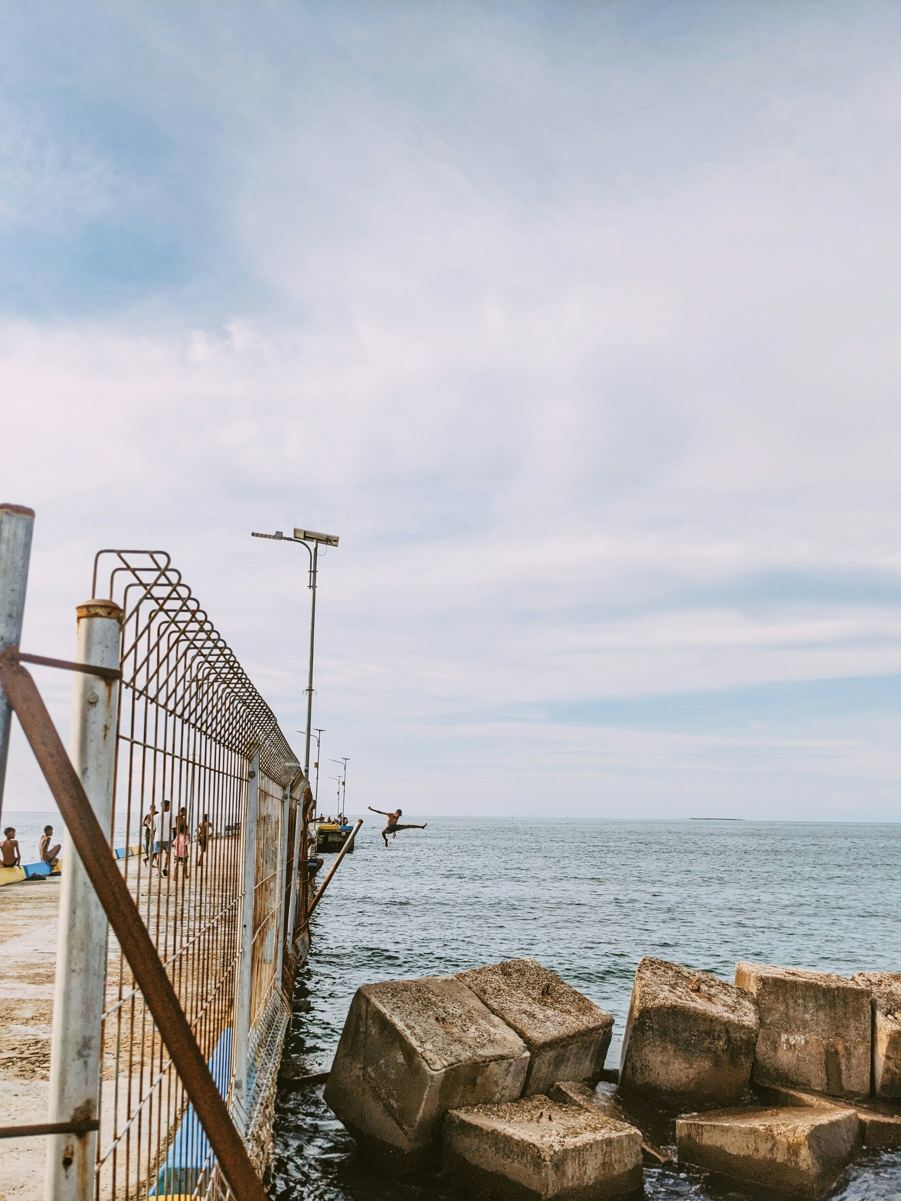 a group of rocks sitting on top of a body of water