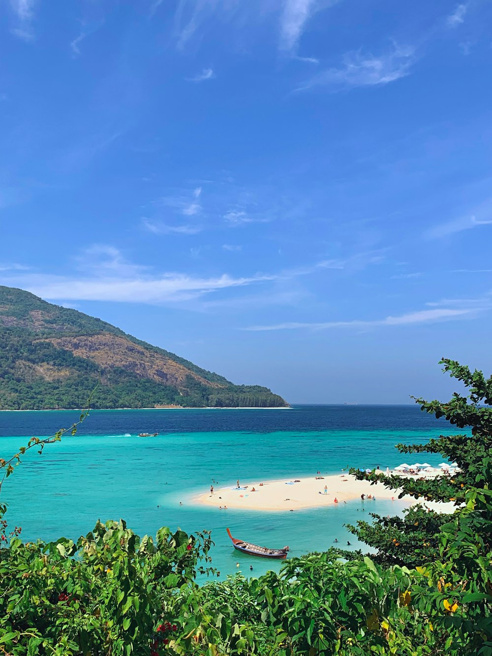 a view of a beach with a boat in the water