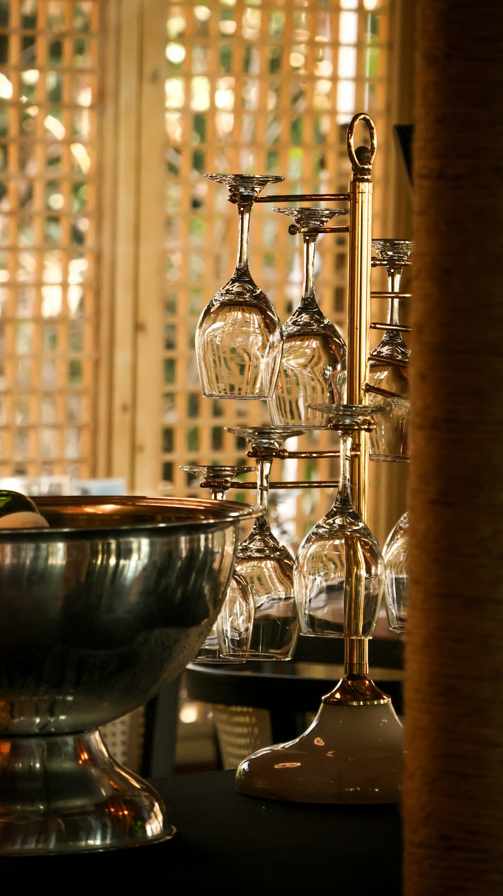 a wine glass rack with wine glasses on it