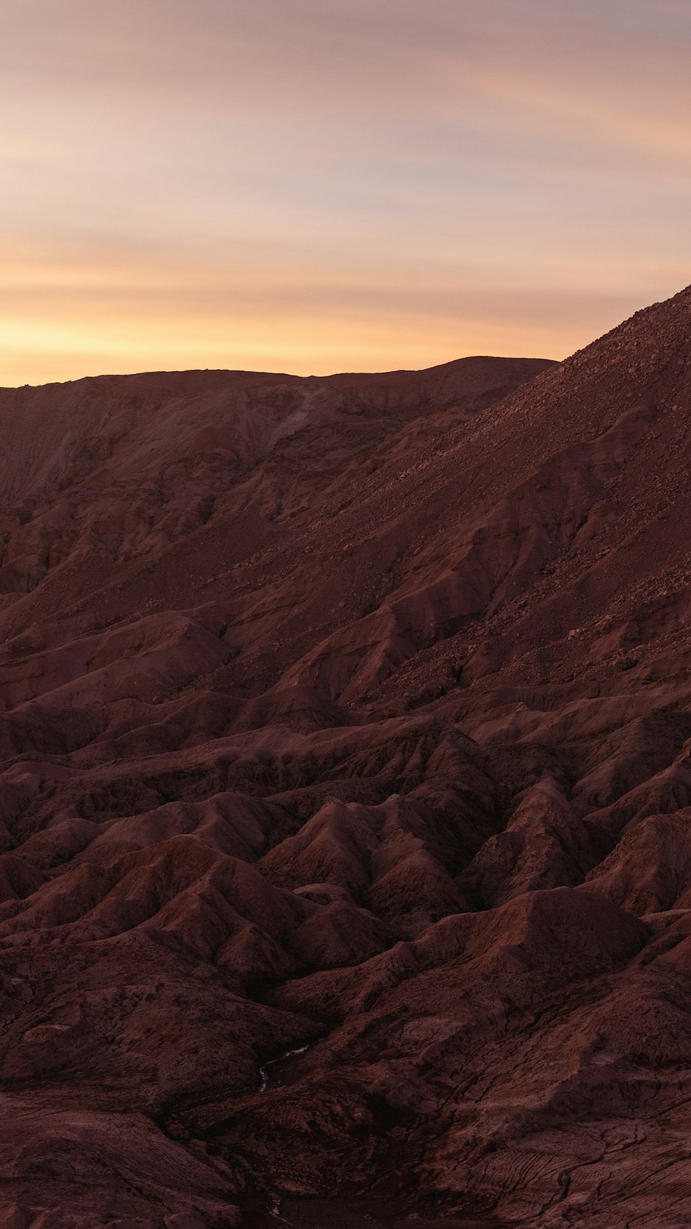 a man riding a horse on top of a mountain