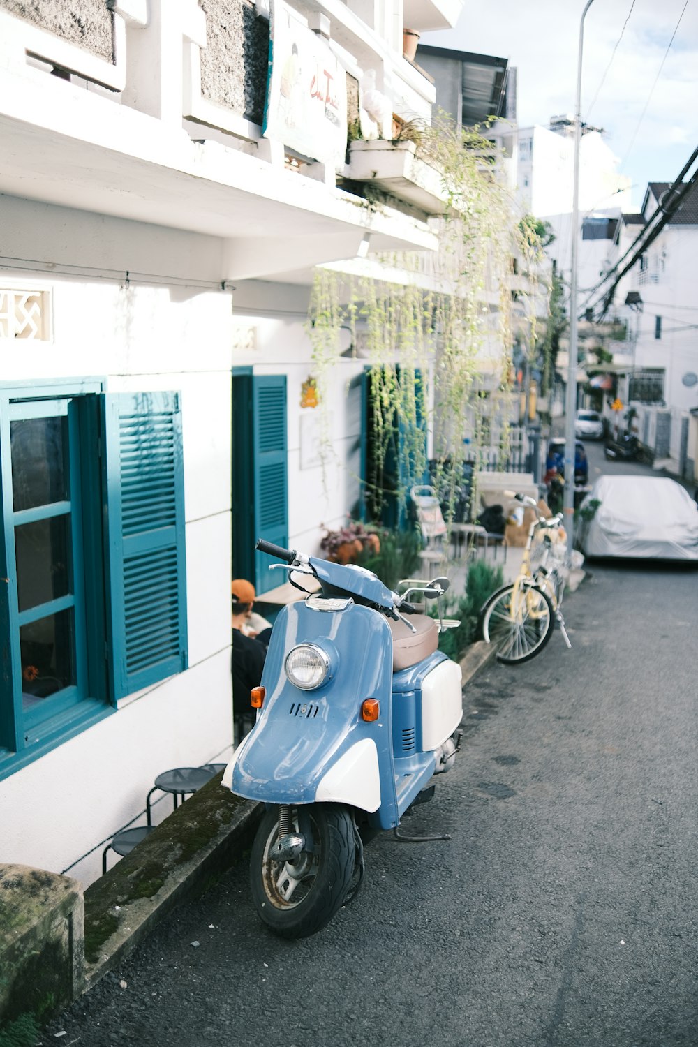 a scooter parked on the side of a street