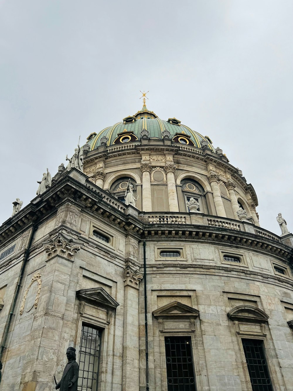 a large building with a statue in front of it